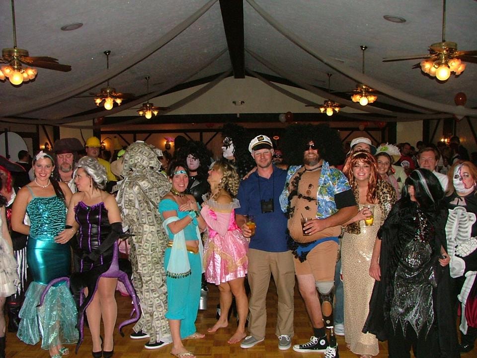 Guests in costume celebrating at an indoor party